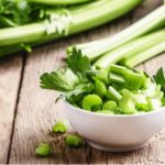 Celery stalks and chopped celery in a bowl