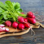 Radishes from the garden on a wooden table